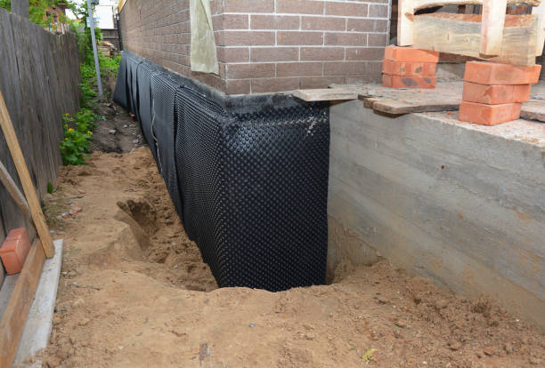Happy homeowners after waterproofing job in Gallatin